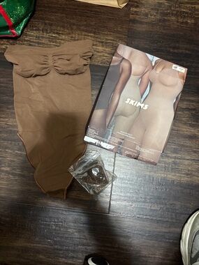 SKIMS Strapless Sheer Bodysuit in Brown